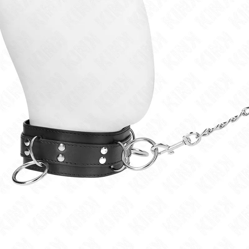 Collier BDSM en cuir noir avec boucles métalliques, design élégant et réglable, idéal pour jeux sophistiqués.