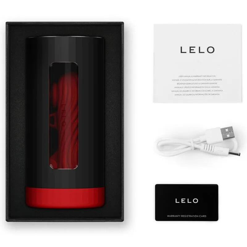Console Plaisir Luxe Connectée noire et rouge, silicone doux, avec câble USB et manuel, dans un coffret élégant.