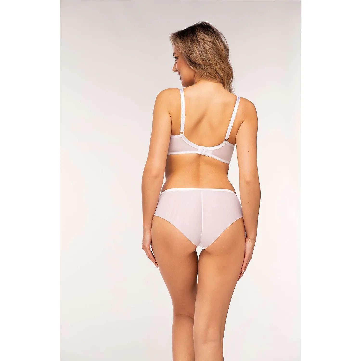 Ensemble lingerie Unikat blanc, dentelle florale, soutien-gorge et culotte transparents, élégant et confortable.