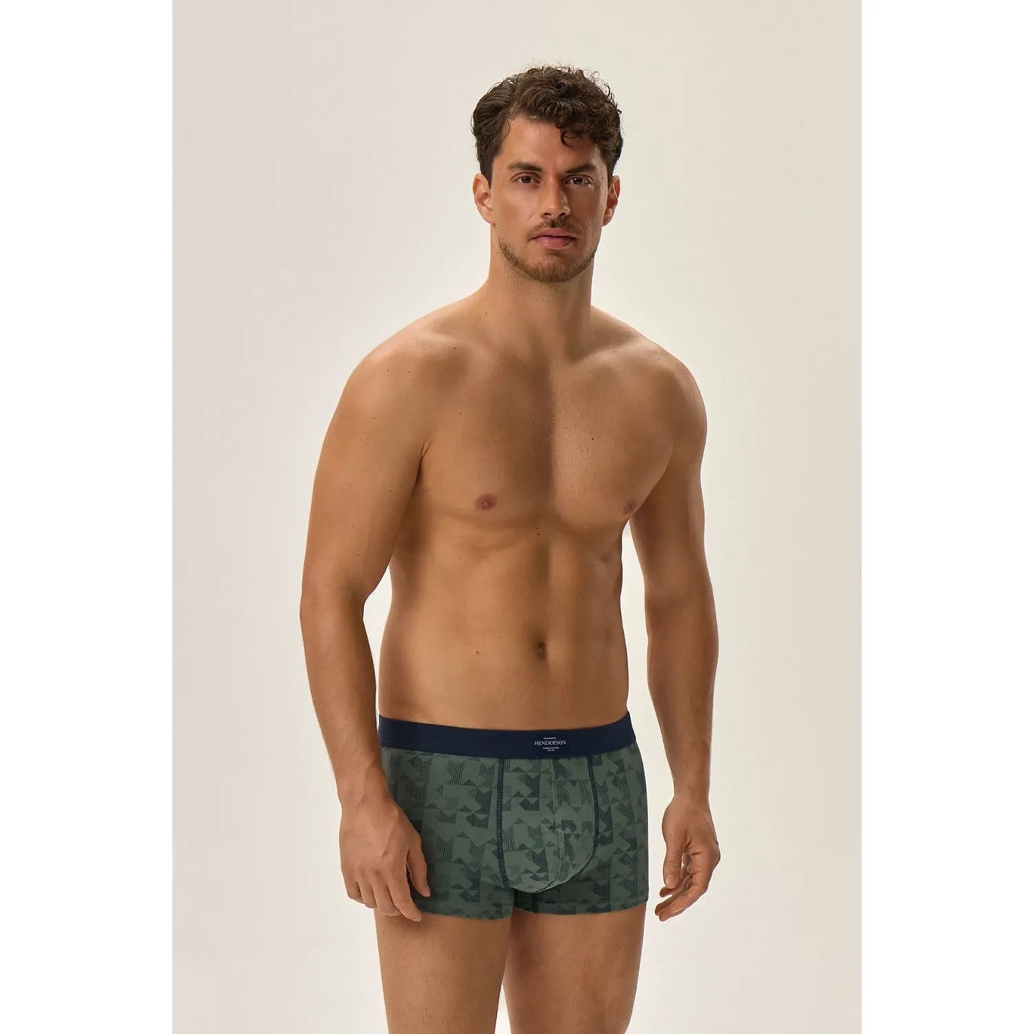 Boxers homme coupe étroite, motif géométrique bleu-vert, ceinture élastique, coton élasthanne, logo Henderson visible.