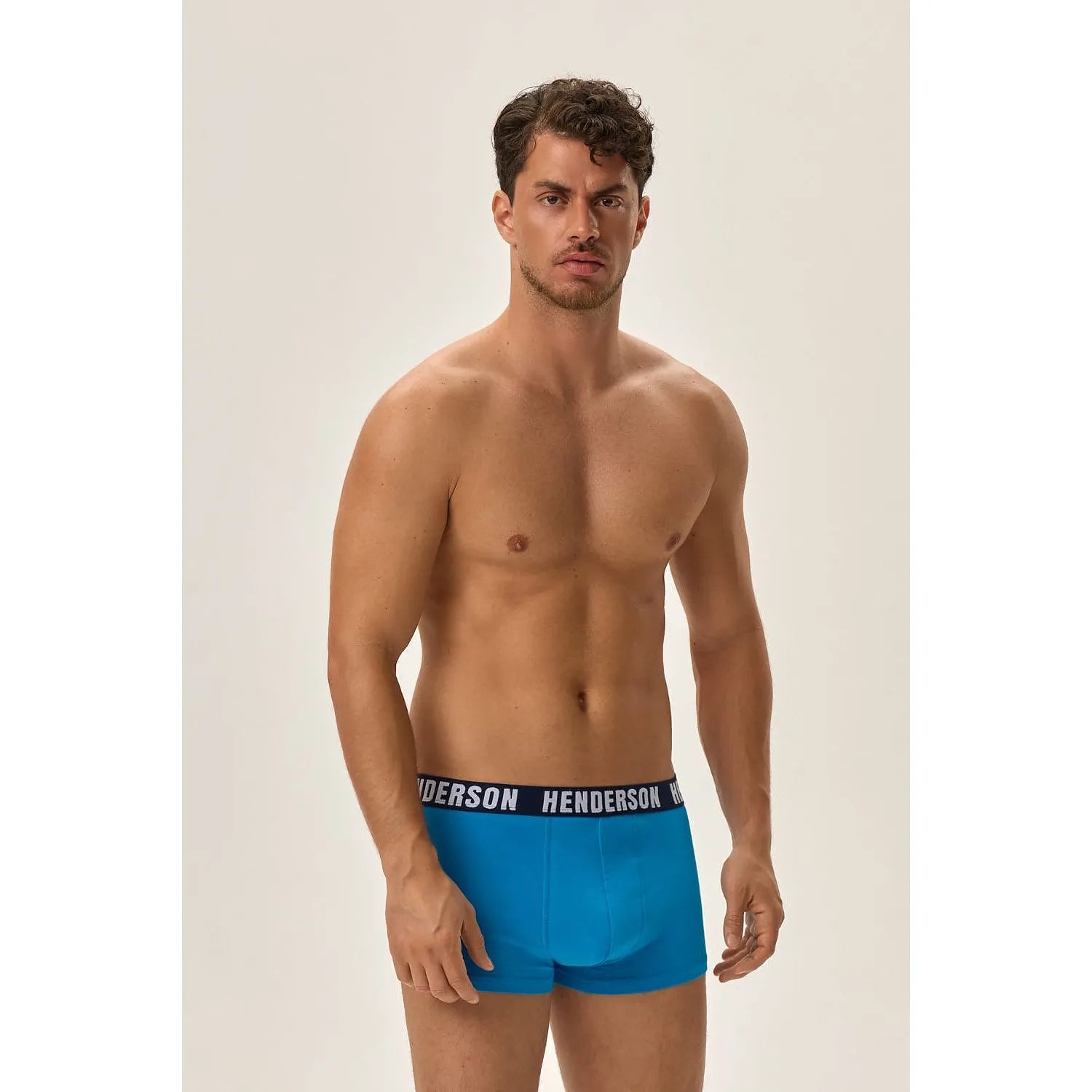 Boxer briefs Henderson bleu turquoise, motif géométrique, ceinture élastique noire logo, confort et style moderne.