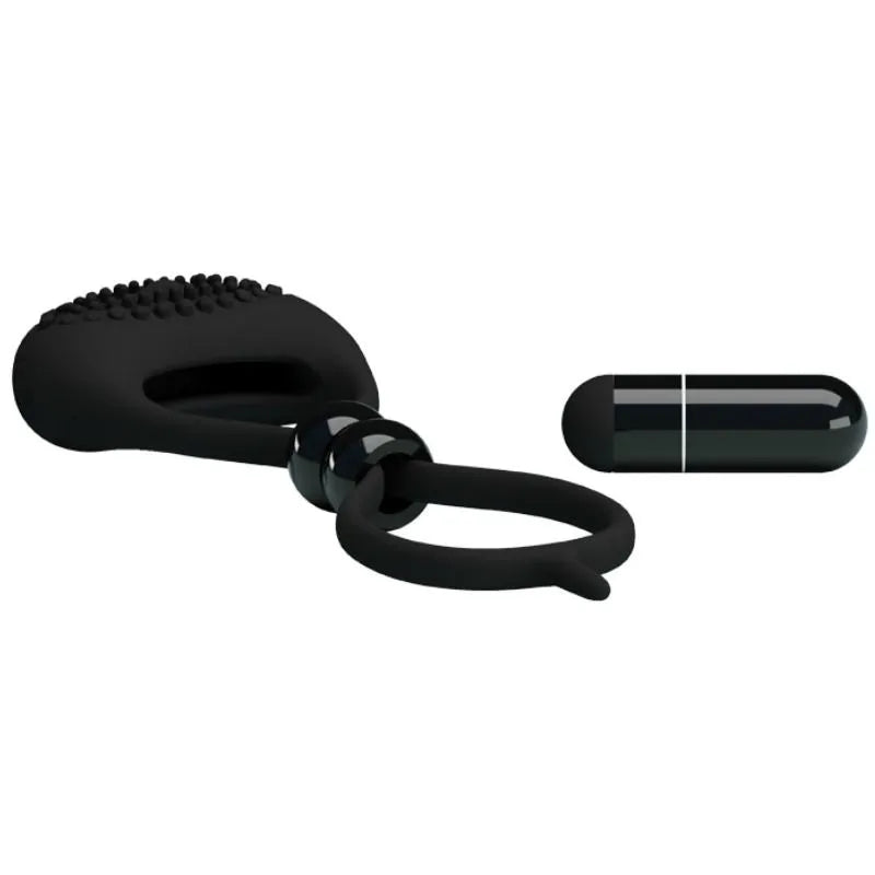 Double anneau vibrant noir en silicone avec balle vibrante intégrée, conçu pour pénis et testicules, confort et intensité.