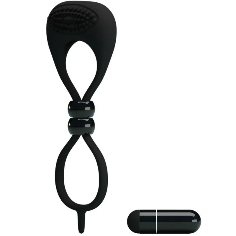 Anneau vibrant noir silicone, double boucle pour pénis et testicules, balle vibrante intégrée, confort et intensité.