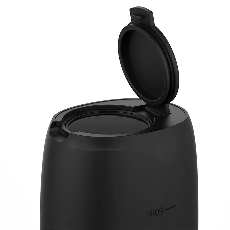 Douche anale automatique noire, compacte, en silicone médical, avec couvercle ouvert, technologie anti-reflux.