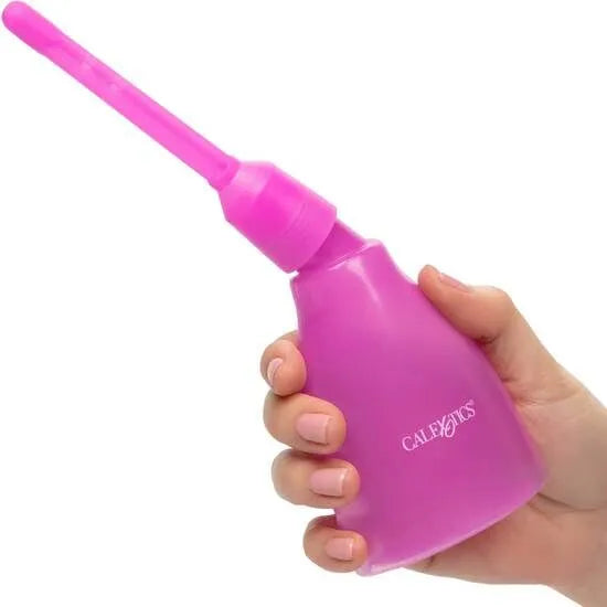 Douche anale réutilisable rose, bouteille transparente, embout démontable, tenue en main, hygiène intime efficace.