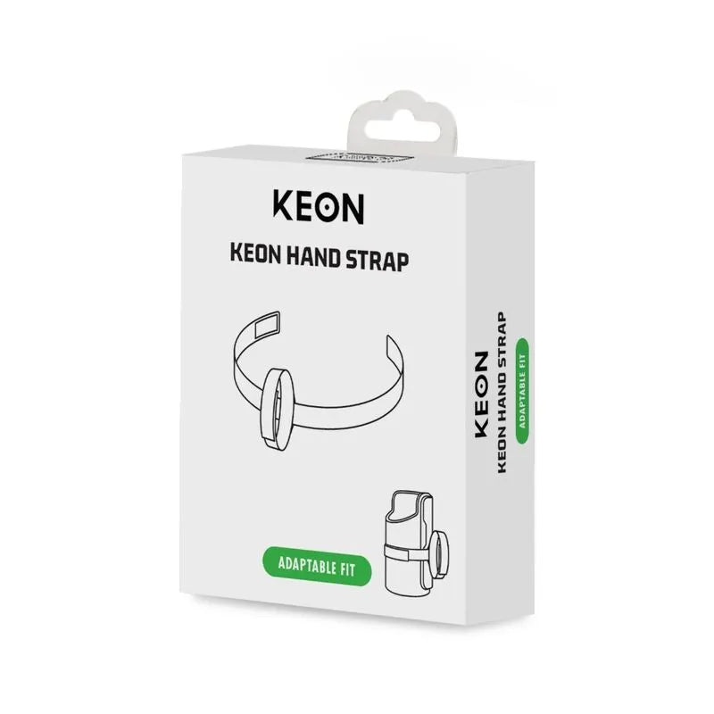Dragonne textile Keon ergonomique, silicone et coton, antidérapante, velcro réglable, boîte blanche avec illustration.