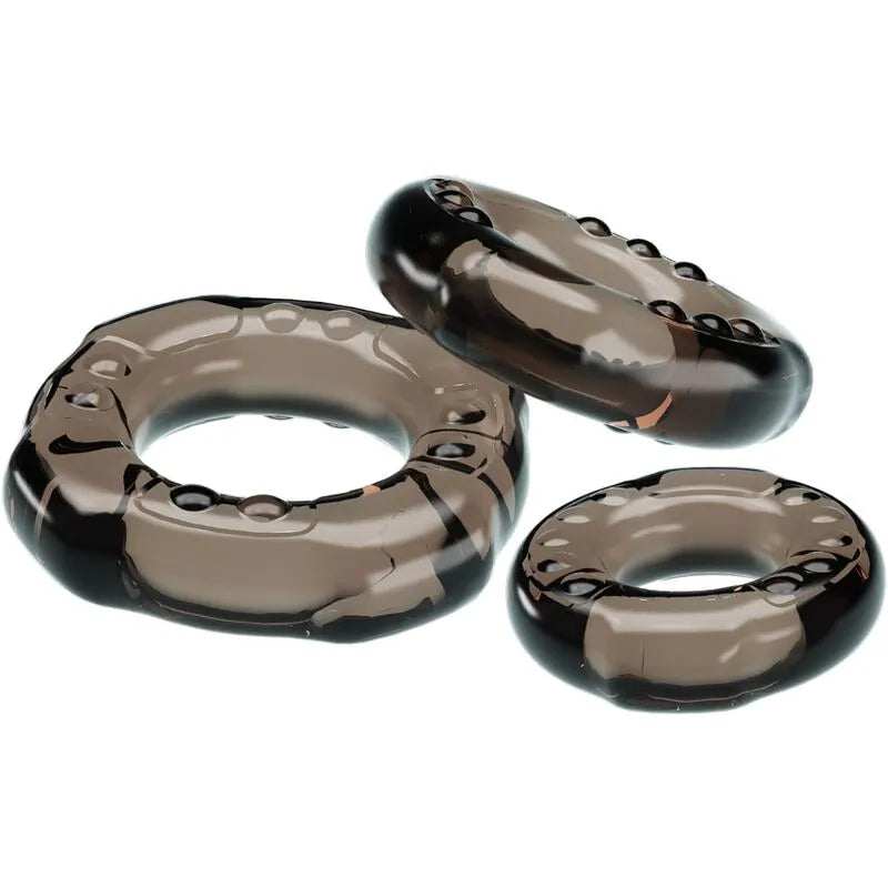 Anneaux péniens noirs extensibles en TPR, trois tailles, forme circulaire, stimulation érection, confort durable.