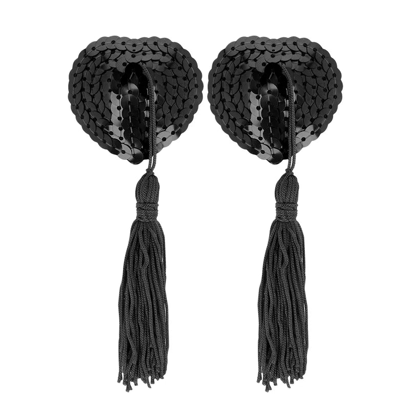 Accessoires sensuels noirs en forme de cœur avec sequins et pompons, inclus dans le Coffret Plaisir Couple Ohmama.