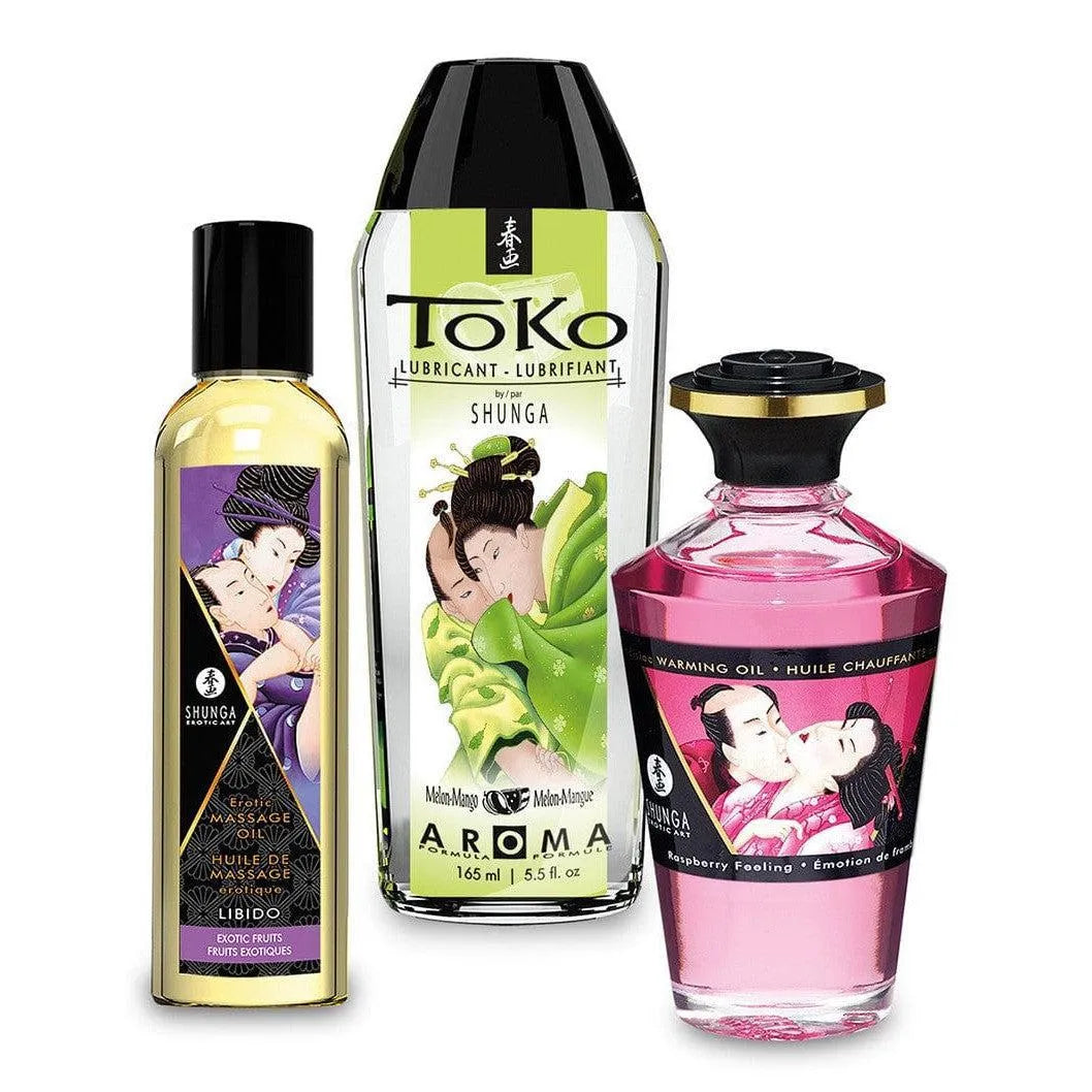 Coffret huiles massage fruits exotiques sensuel, flacons colorés, arômes envoûtants, expérience intime et aphrodisiaque.