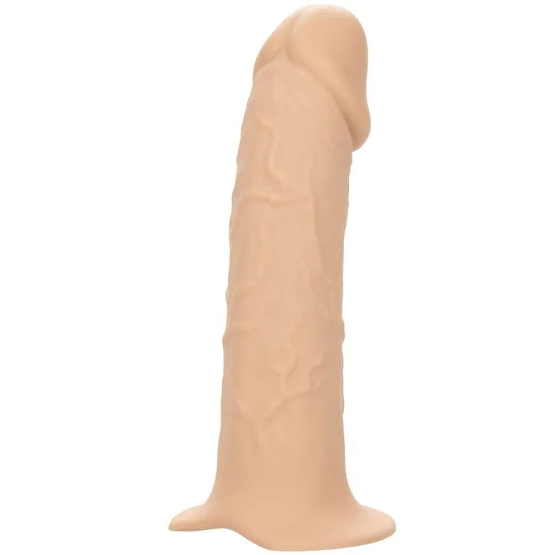 Extension de harnais réaliste en silicone beige, texturée, avec base large et anneau métallique, imperméable et durable.