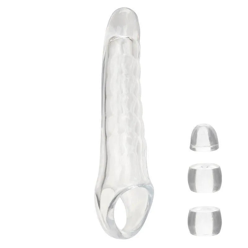 Extension godemichet transparent réaliste, texture nervurée, tête douce, sangle scrotale, trois butées ajustables.