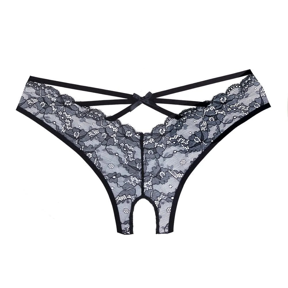Culotte noire en dentelle ouverte, lanières croisées arrière, élastique, douce, extensible, polyester et élasthanne.
