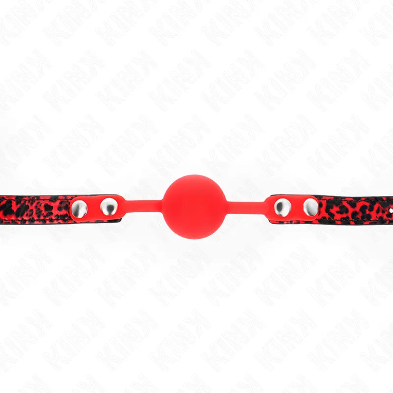 Gag BDSM rouge en silicone doux avec sangle ajustable noire à motifs, idéal pour confort et sécurité.