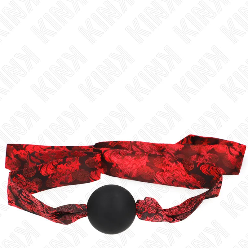 Gag BDSM en silicone noir avec sangle rouge ajustable, design ergonomique et élégant, idéal pour confort et sécurité.
