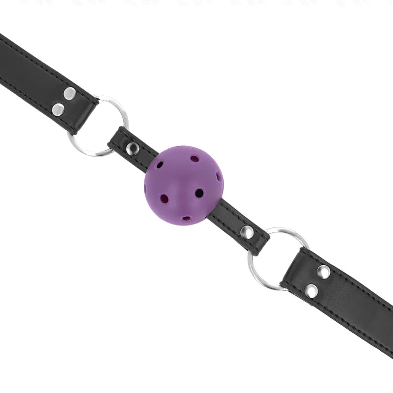 Gag BDSM silicone violet avec sangles noires ajustables, cerceaux métalliques, design ergonomique et hypoallergénique.