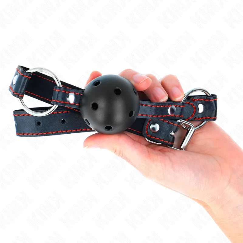 Gag BDSM en silicone noir ajustable avec sangles rouges, design élégant et sécurisé pour confort et soumission.