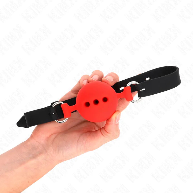 Bâillon BDSM en silicone rouge avec sangles noires réglables, design ergonomique et discret pour confort et sécurité.