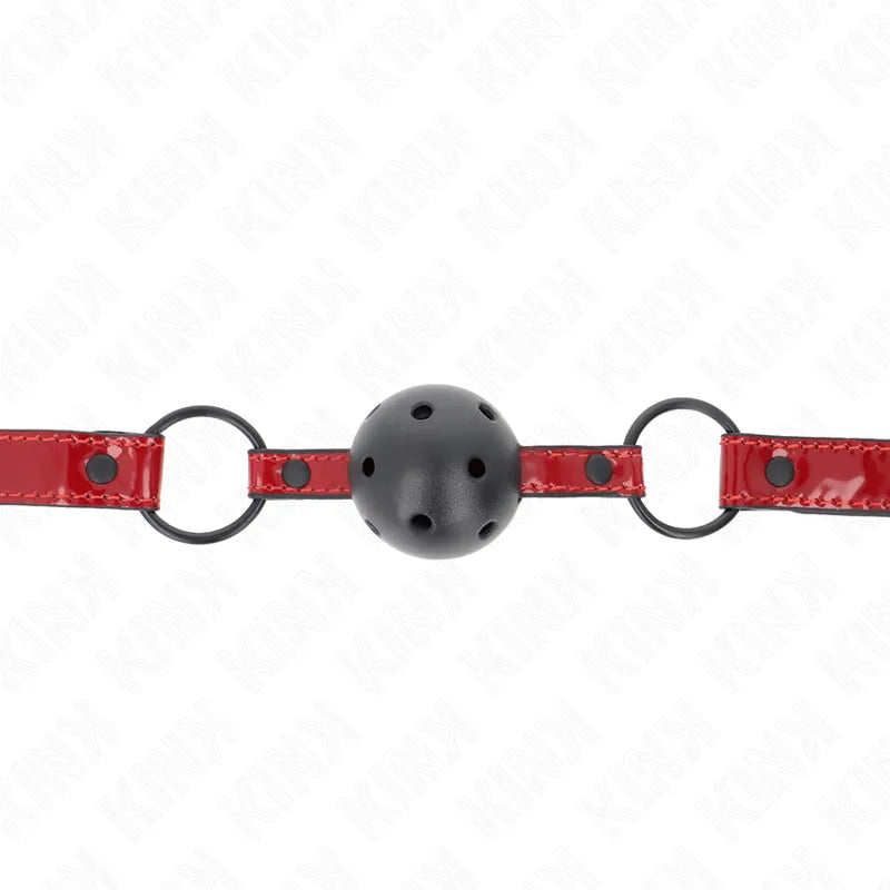 Gag BDSM en silicone noir avec sangle rouge, ajustable et ergonomique, idéal pour confort et sécurité lors des jeux intimes.