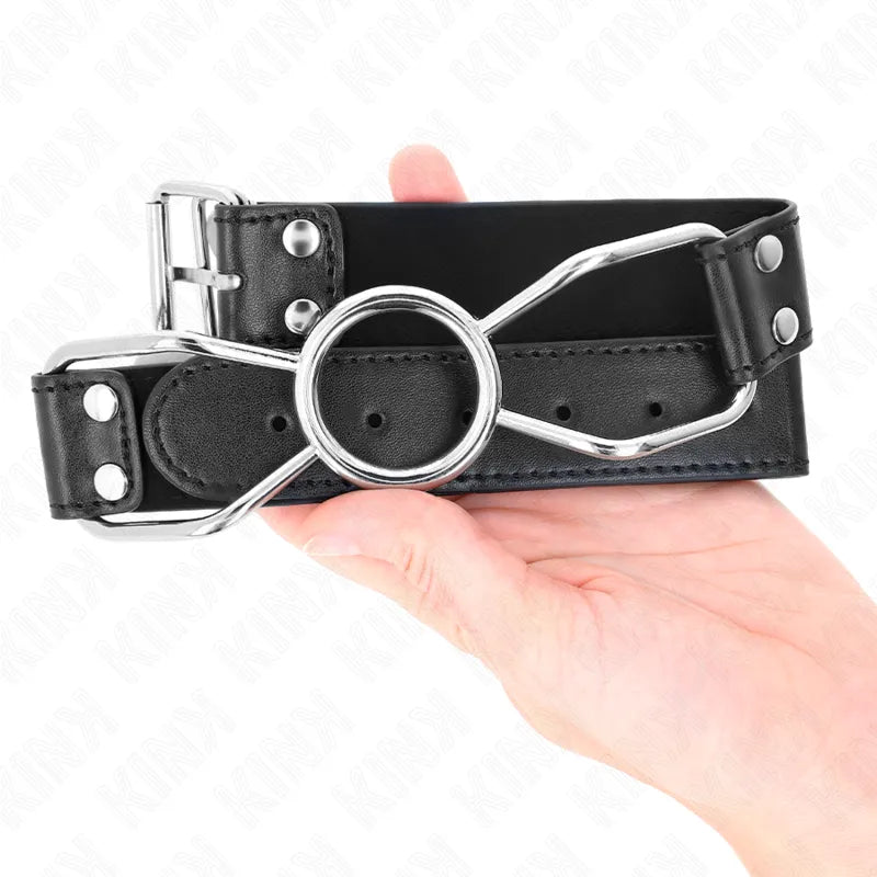 Gag BDSM en silicone noir avec cerceau métallique, réglable, ergonomique, hypoallergénique, pour soumission sécurisée.