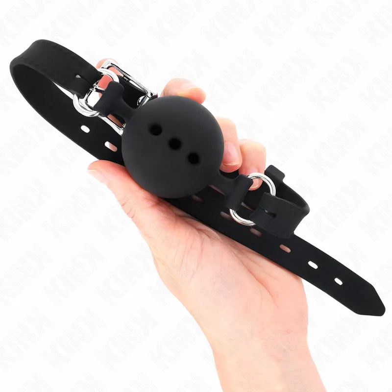 Gag BDSM en silicone noir avec boule perforée, sangle réglable et boucle métallique, design ergonomique et vibrant.