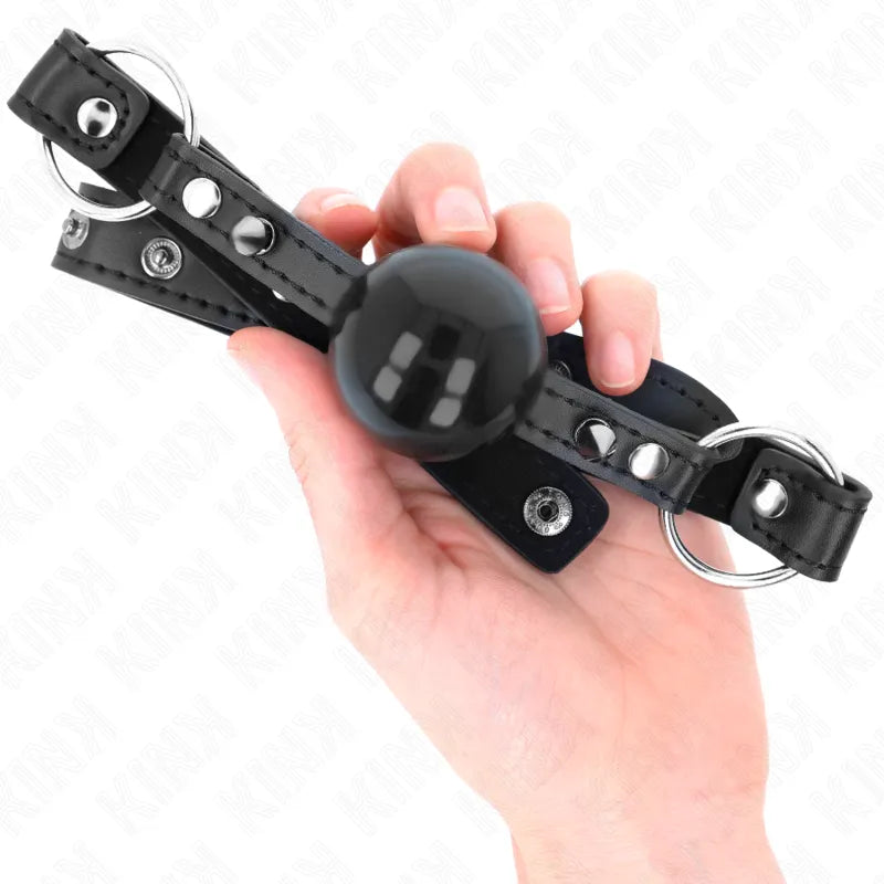 Gag BDSM en silicone noir ajustable, ergonomique et discret, avec cerceau et mors pour confort et sécurité optimaux.