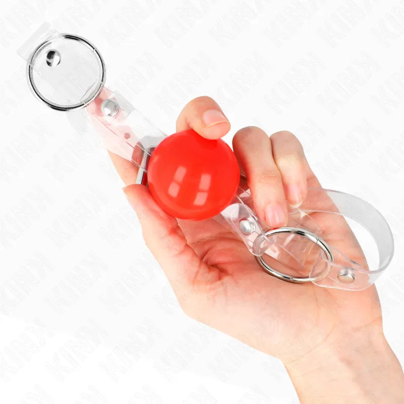 Gag BDSM silicone rouge avec sangles transparentes réglables, ergonomique et hypoallergénique pour confort et sécurité.