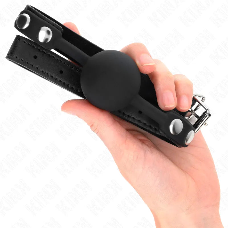 Gag BDSM en silicone noir, ajustable avec bretelles robustes et boucle métallique, design ergonomique et élégant.