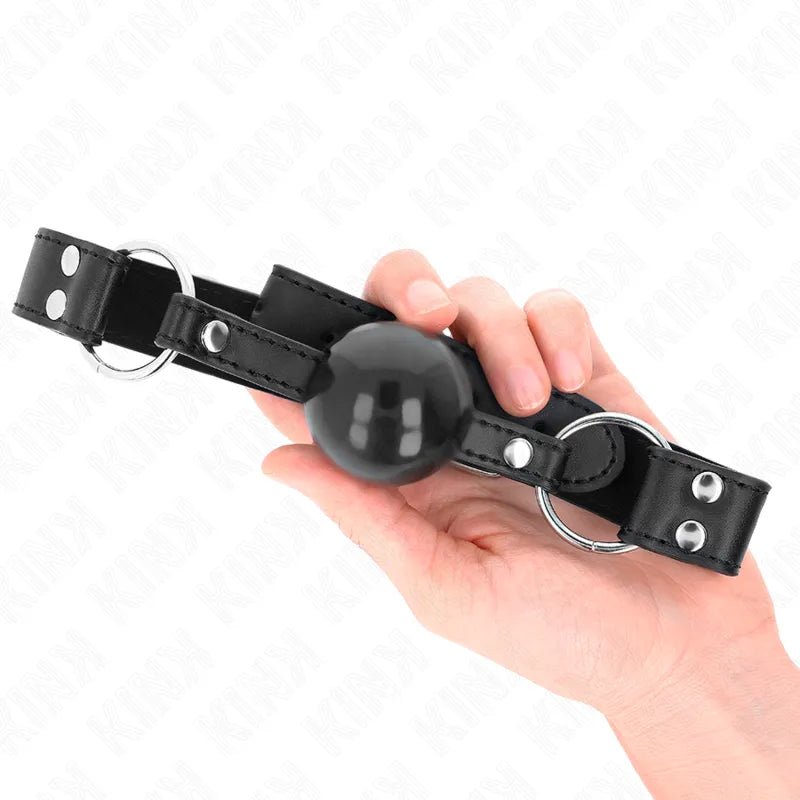 Gag BDSM en silicone noir avec boule, lanières réglables en cuir noir et anneaux métalliques, design ergonomique et élégant.