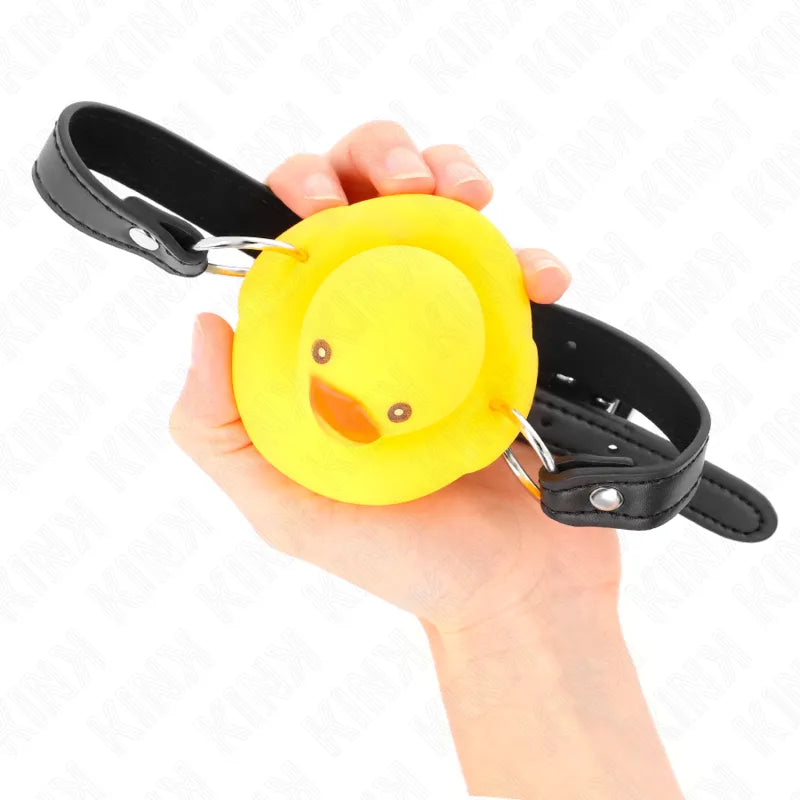 Gag BDSM silicone jaune canard, ajustable, hypoallergénique, avec sangle noire, ergonomique et esthétique.