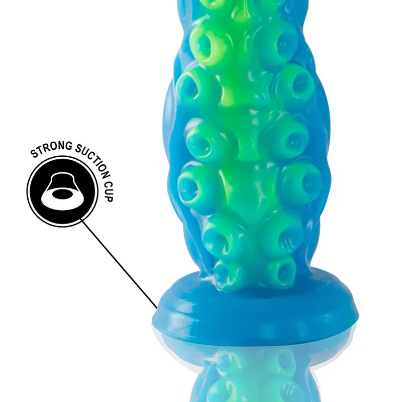 Gode silicone bleu et vert, inspiré mythologie grecque, forme ergonomique, base ventouse stable, détails texturés.