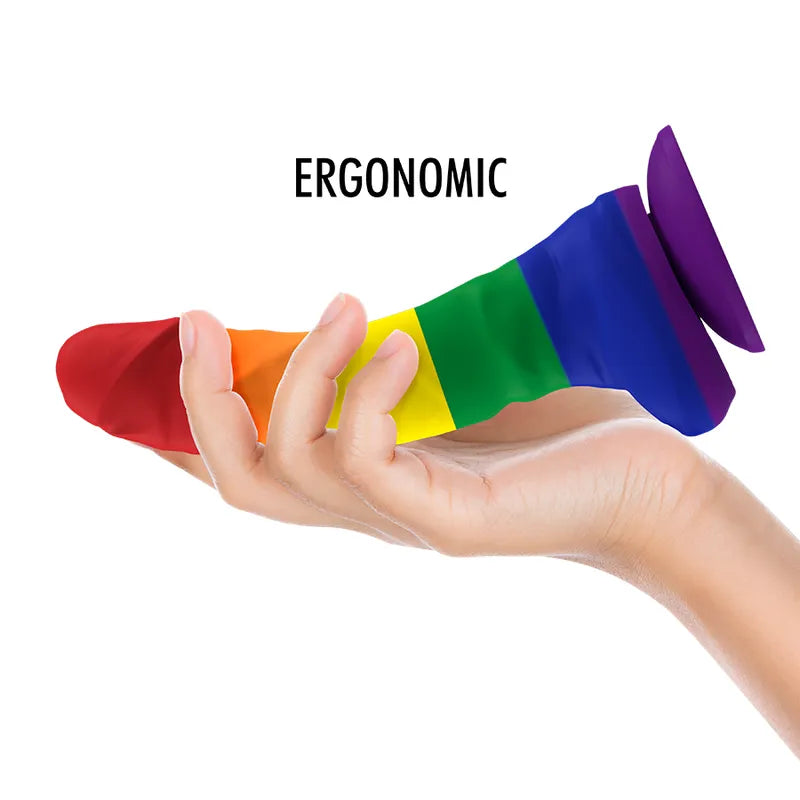 Gode en silicone multicolore ergonomique avec base à ventouse, flexible, hypoallergénique, sur fond blanc.