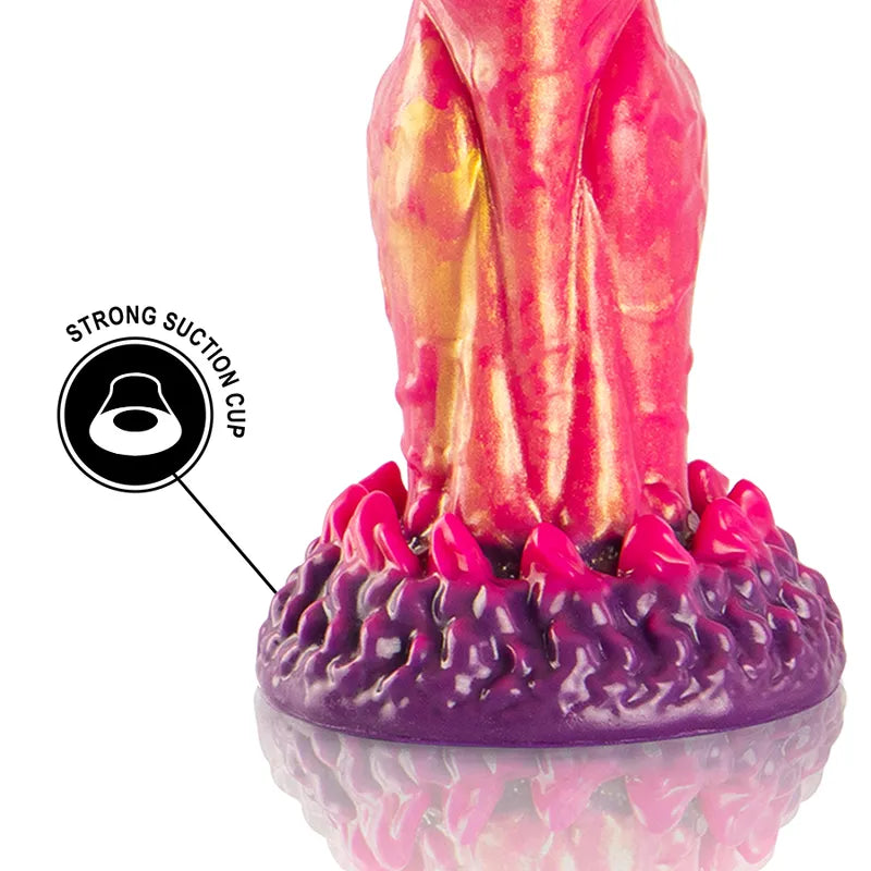 Gode mythologique Cerbère en silicone, rouge et or, trois têtes, texture réaliste, base ventouse violette.