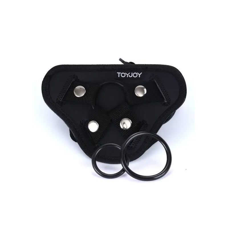 Harnais noir doux réglable avec coussin rembourré, anneaux en silicone interchangeables, fixations ajustables.