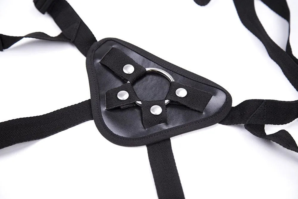 Harnais gode ceinture noir en cuir PVC, réglable, avec anneaux interchangeables en acier, design robuste et confortable.