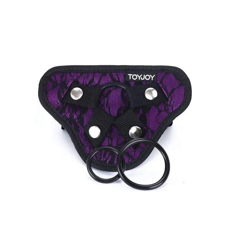 Harnais réglable violet et noir, rembourré, avec bretelles ajustables et anneaux en silicone pour jeux de rôle intimes.