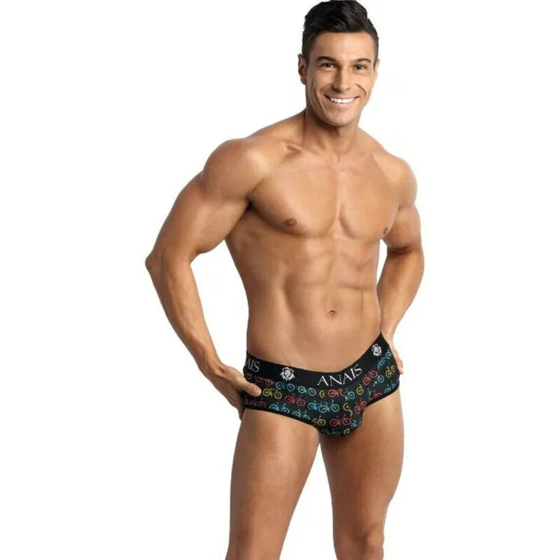 Slip bikini homme noir Anais, coupe audacieuse, fesses ouvertes, motifs colorés, matière haute qualité, sexy et ludique.