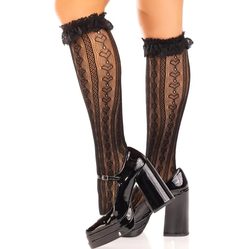Chaussettes hautes noires à volants dentelle et motifs cœurs, élégantes et confortables, portées avec des talons noirs.