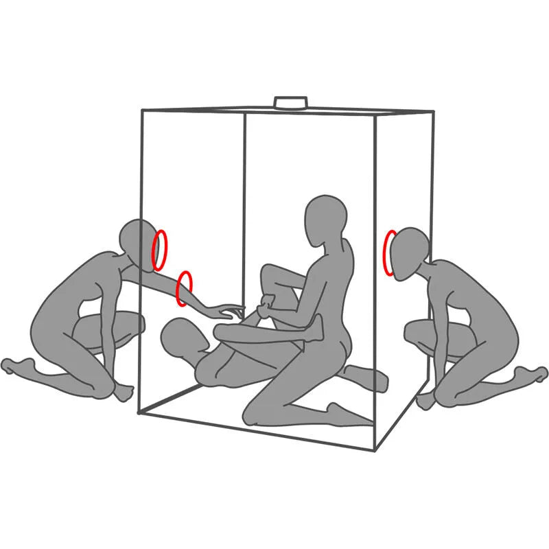 Cabine BDSM noire et rouge avec LED, pinces, menottes et chaînes pour immersion sensorielle et contrôle total.