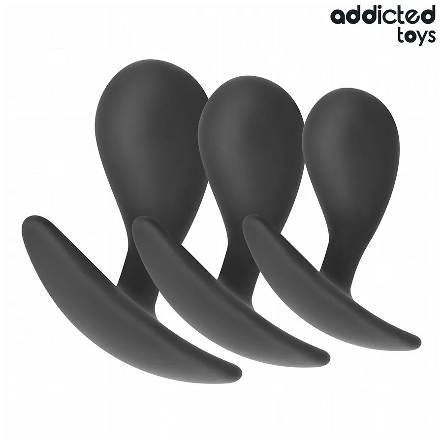 Ensemble de trois plugs anaux noirs en silicone médical, tailles progressives, base élargie, texture lisse, Addicted Toys.