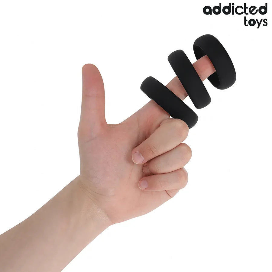 Anneaux péniens noirs en silicone médical plat, trois tailles, flexibles et ergonomiques pour érection prolongée.