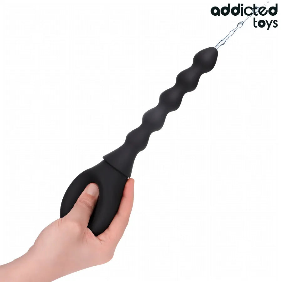 Nettoyeur de voyage Addicted Toys noir, design ondulé, ergonomique, idéal pour hygiène des jouets en déplacement.