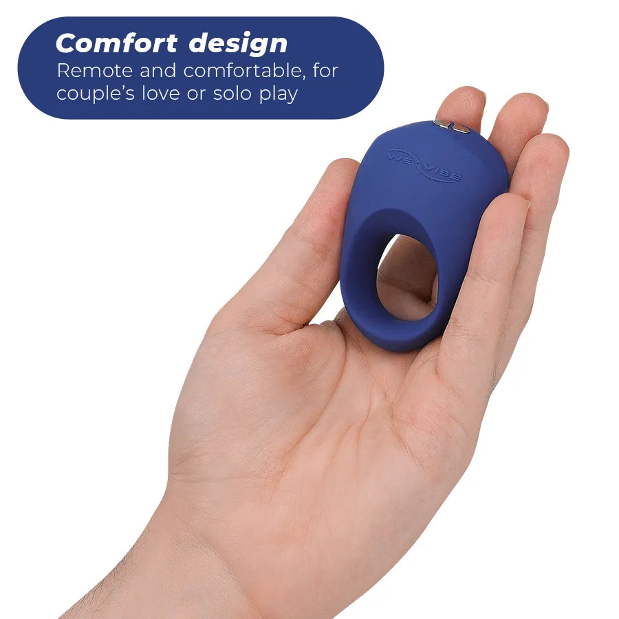Anneau vibrant bleu en silicone, ergonomique, rechargeable, pour stimulation clitoridienne, tenu dans une main.