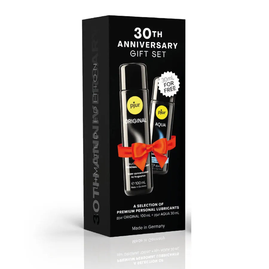 Coffret Pjur édition limitée 30e anniversaire avec lubrifiants silicone et eau, flacons 100ml et 30ml, design élégant.