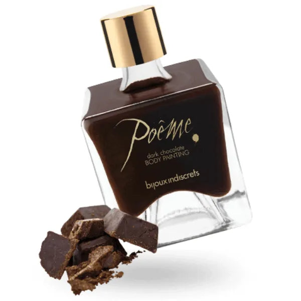 Flacon de peinture corporelle comestible chocolat noir avec bouchon doré, morceaux de chocolat à côté.
