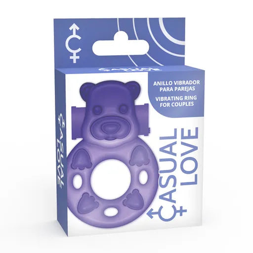 Anneau violet en TPR avec stimulateur clitoridien, design flexible, dans une boîte bleue, vibrations intenses.