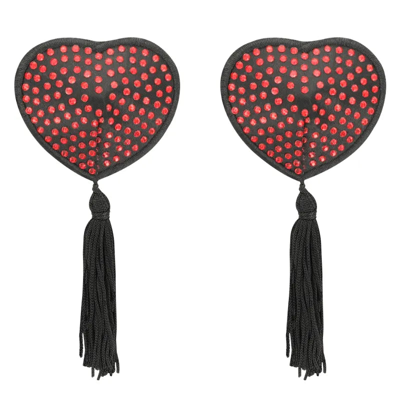 Cache-tétons adhésifs cœur rouge à pois noirs avec pompons, élégants et sensuels, réutilisables pour confort et discrétion.
