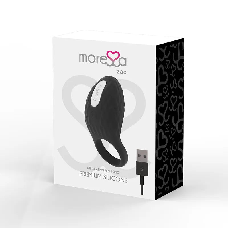 Anneau vibrant noir en silicone texturé, ergonomique, hypoallergénique, sur fond blanc, avec câble USB, Moressa Zac.